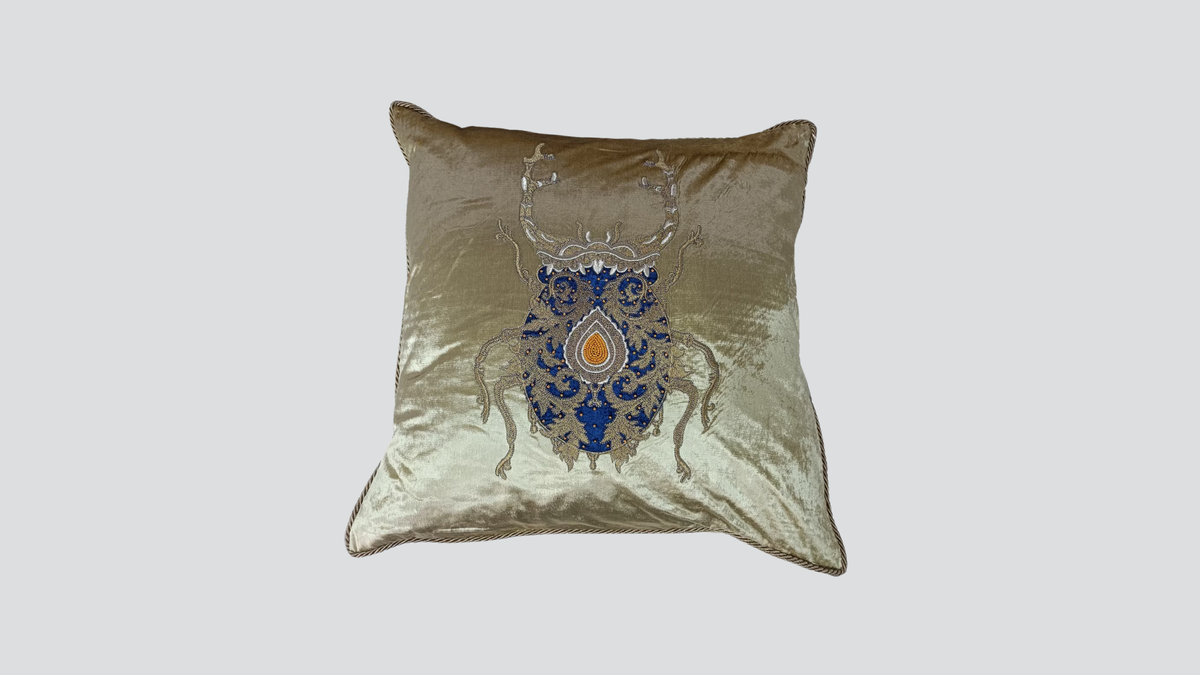 Cushion cover - hand embroidered - gold w/ gold & blue bug